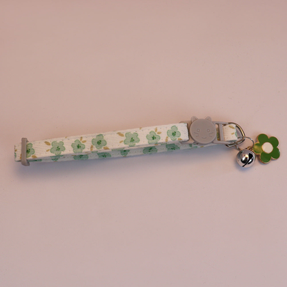 Green floral cat collar with cat-face buckle, bell and green flower charm