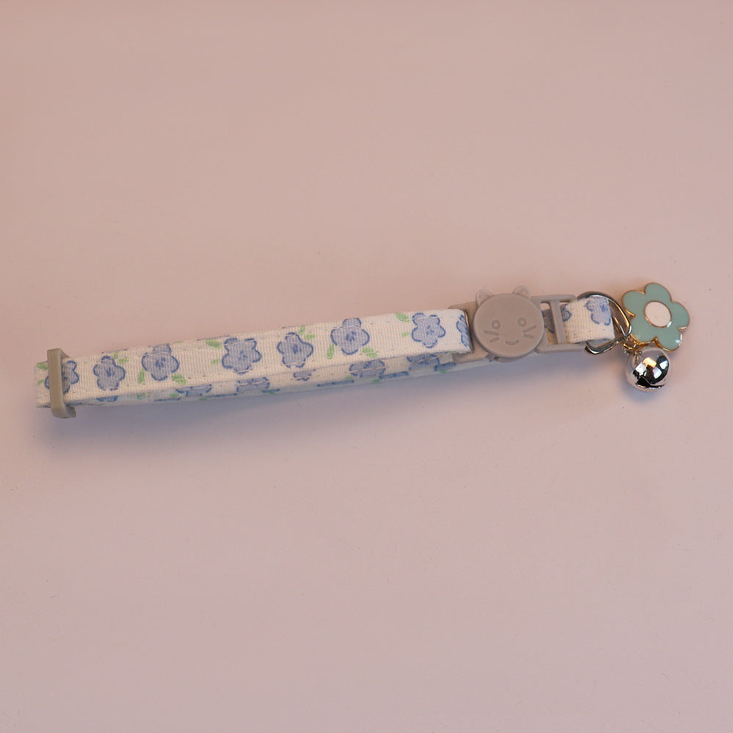 Blue floral cat collar with cat-face buckle, bell and blue flower charm