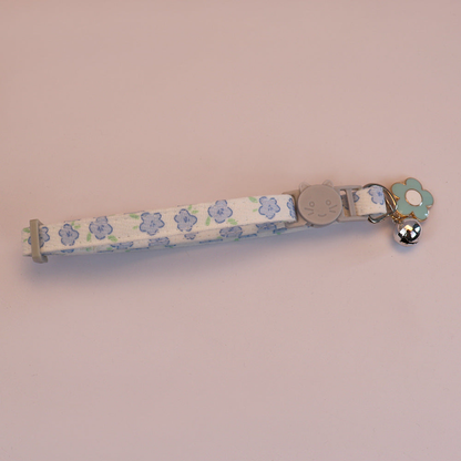 Blue floral cat collar with cat-face buckle, bell and blue flower charm