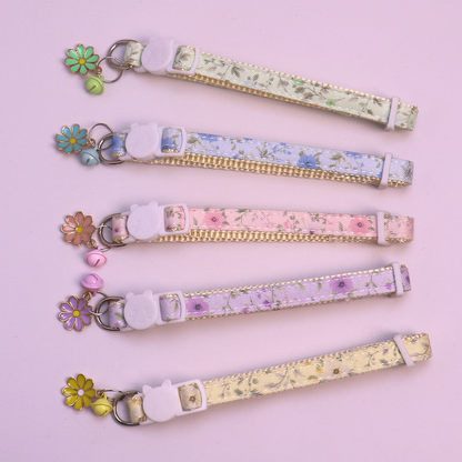 Five floral cat collars with color-coordinated bells and flower charms