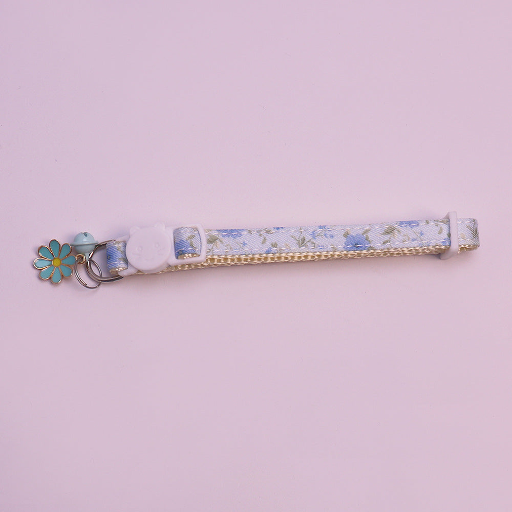 Light blue floral cat collar with bell and flower charm