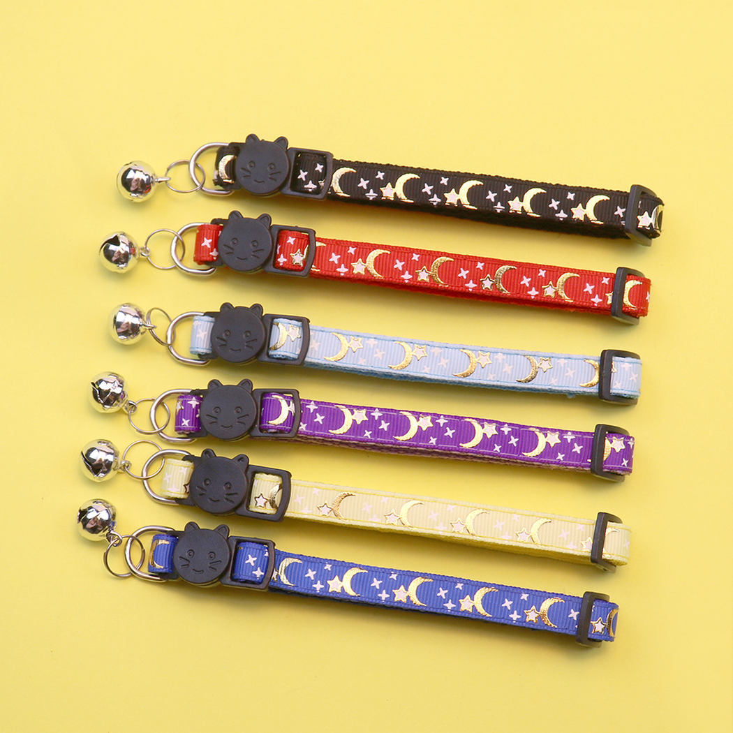 Six moon and star cat collars laid flat in assorted colors