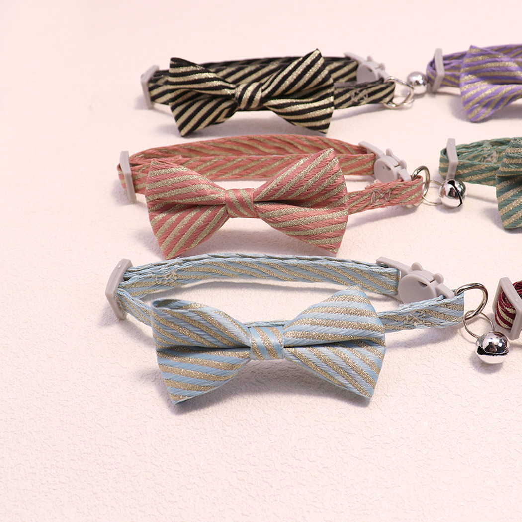Light blue, dusty pink and black striped bow cat collars arranged together