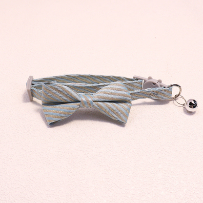 Light blue striped bow cat collar with bell and cat-face buckle