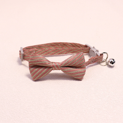 Dusty pink striped bow cat collar with bell and cat-face buckle