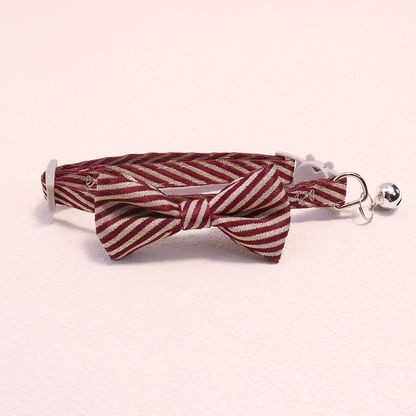 Burgundy striped bow cat collar with bell and cat-face buckle