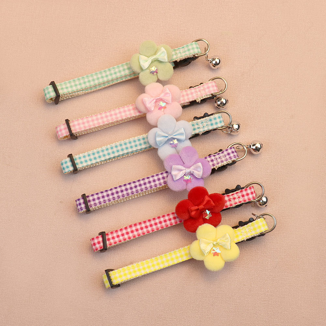 Six gingham cat collars with flower, bow and bell decorations
