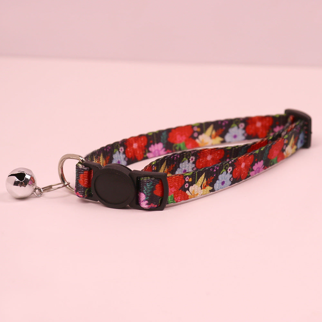 Black floral cat collar with cat-face buckle and bell
