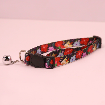 Black floral cat collar with cat-face buckle and bell