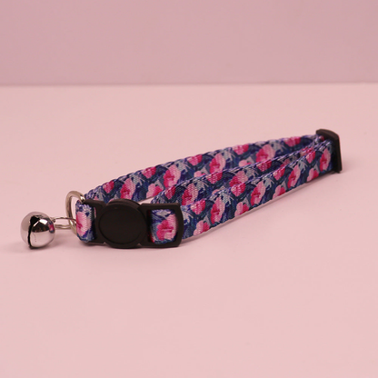 Navy floral cat collar with cat-face buckle and bell