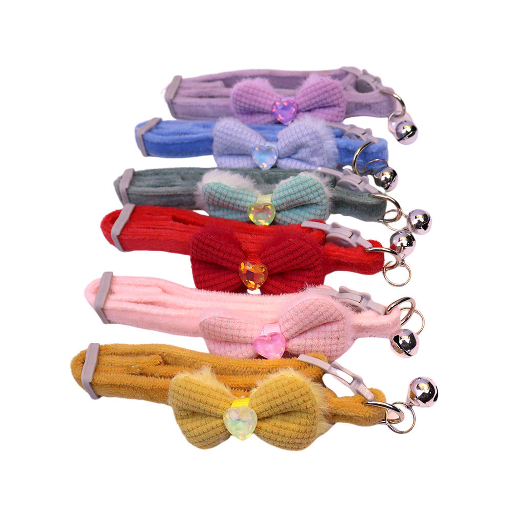 Six colorful bow cat collars with heart accents and bells