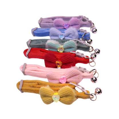 Six colorful bow cat collars with heart accents and bells