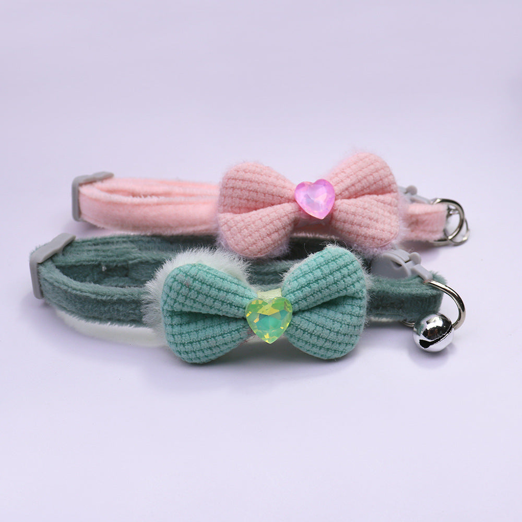 Pink and green bow cat collars with heart accents and bells
