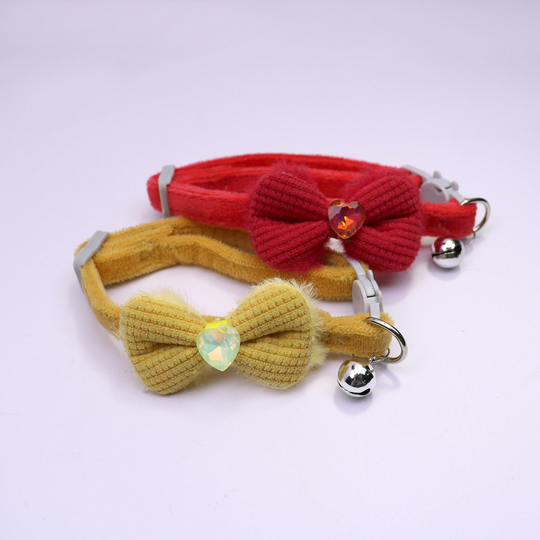 Red and mustard bow cat collars with heart accents and bells