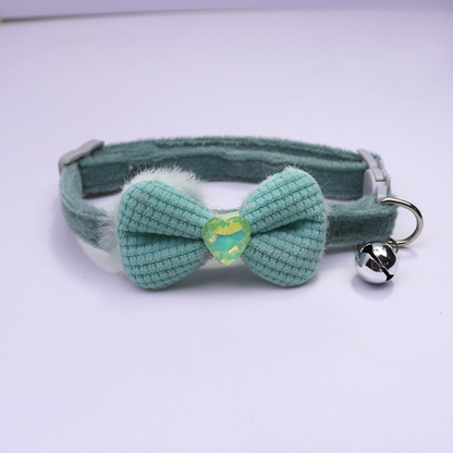 Green bow cat collar with heart accent and silver-tone bell