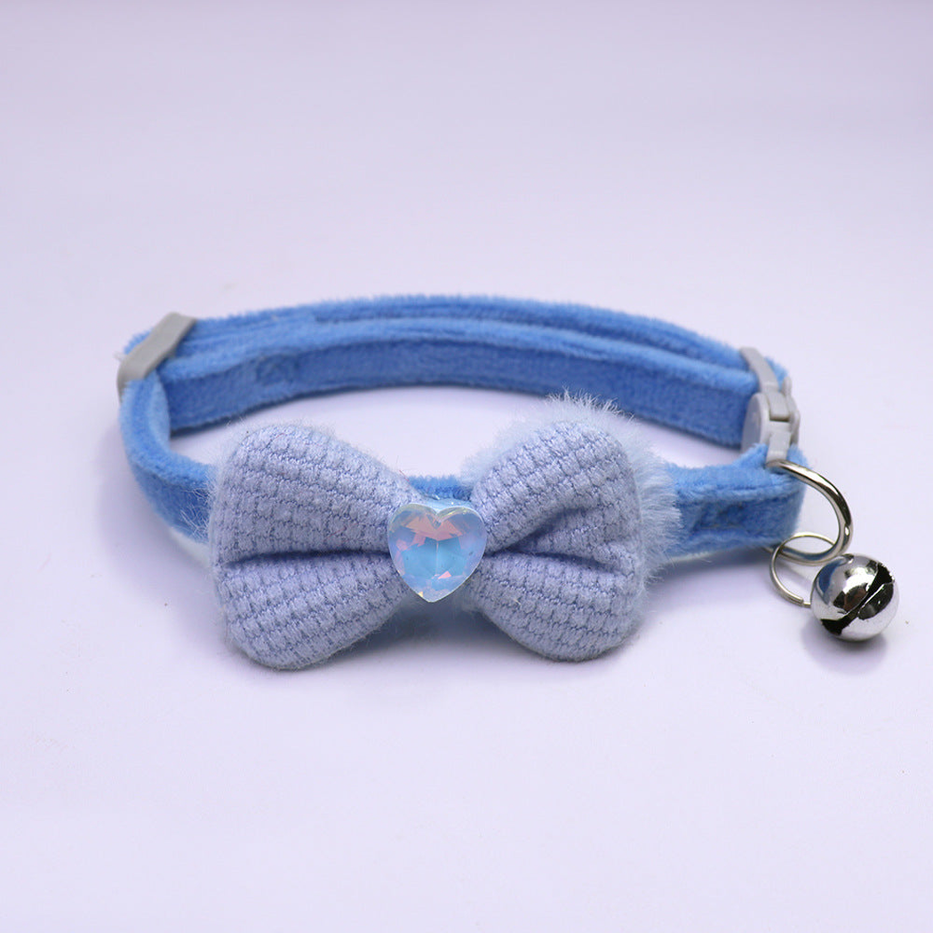 Blue bow cat collar with heart accent and silver-tone bell