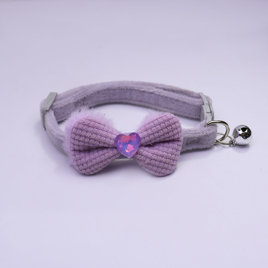 Light purple bow cat collar with heart accent and silver-tone bell