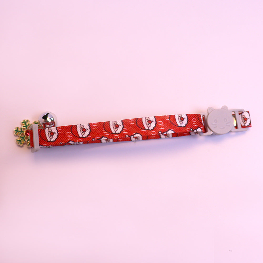 Red Santa-pattern cat collar with cat-face buckle, bell and snowflake charm