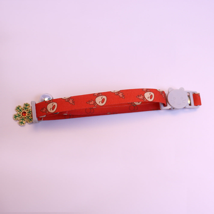 Red reindeer-pattern cat collar with cat-face buckle, bell and snowflake charm