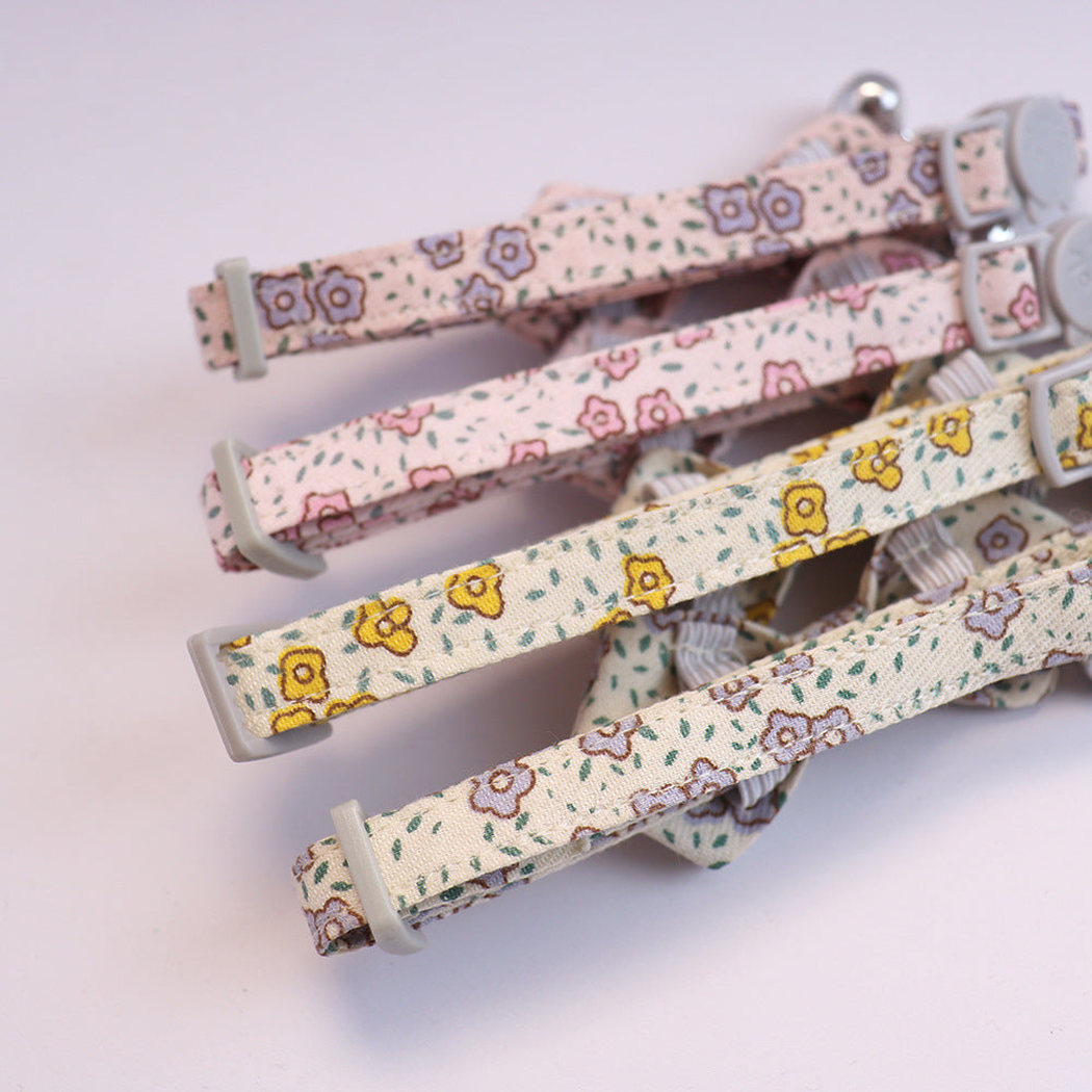 Close-up of the floral collar straps, stitching and adjustment sliders