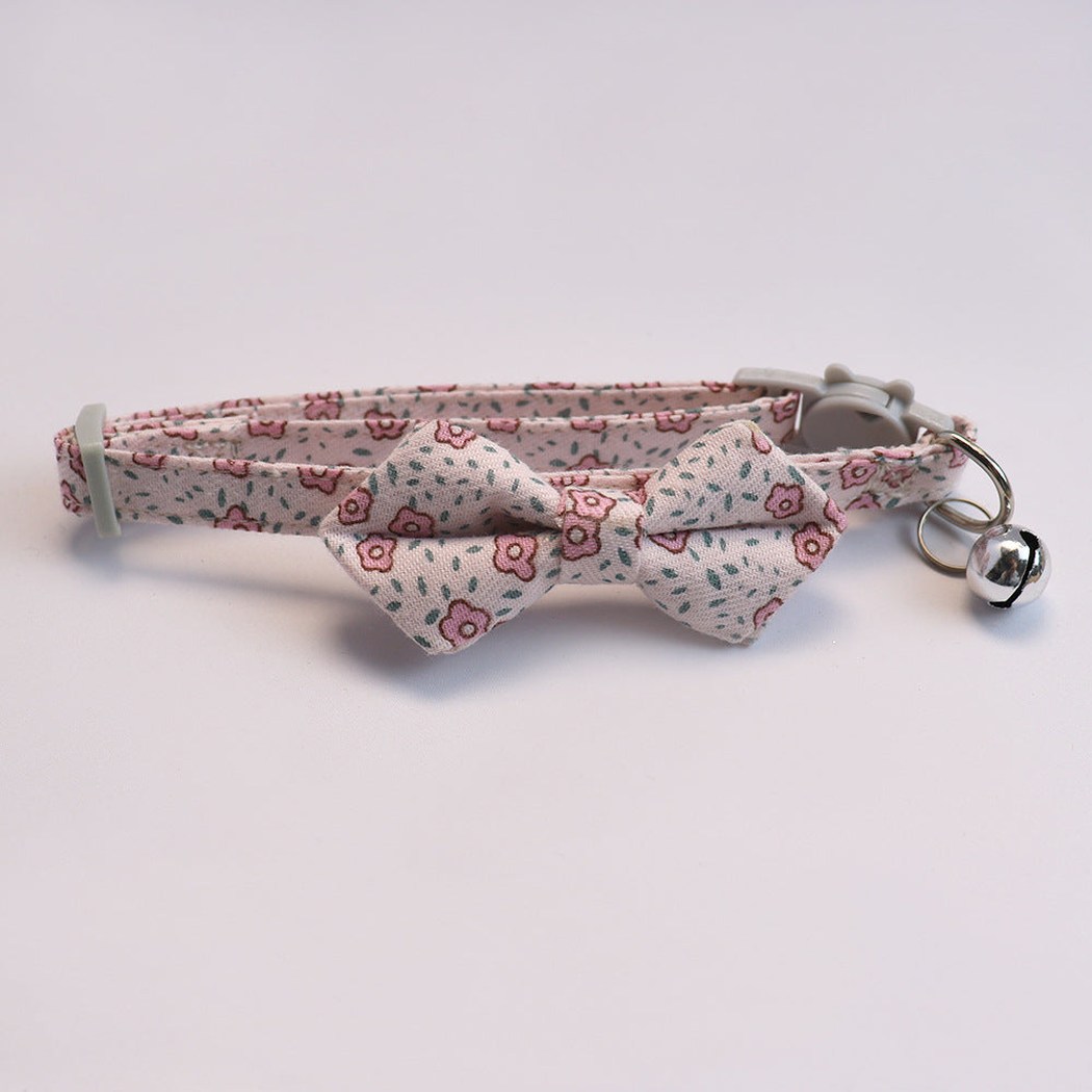Light pink floral cat collar with bow and silver-tone bell
