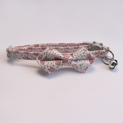 Light pink floral cat collar with bow and silver-tone bell