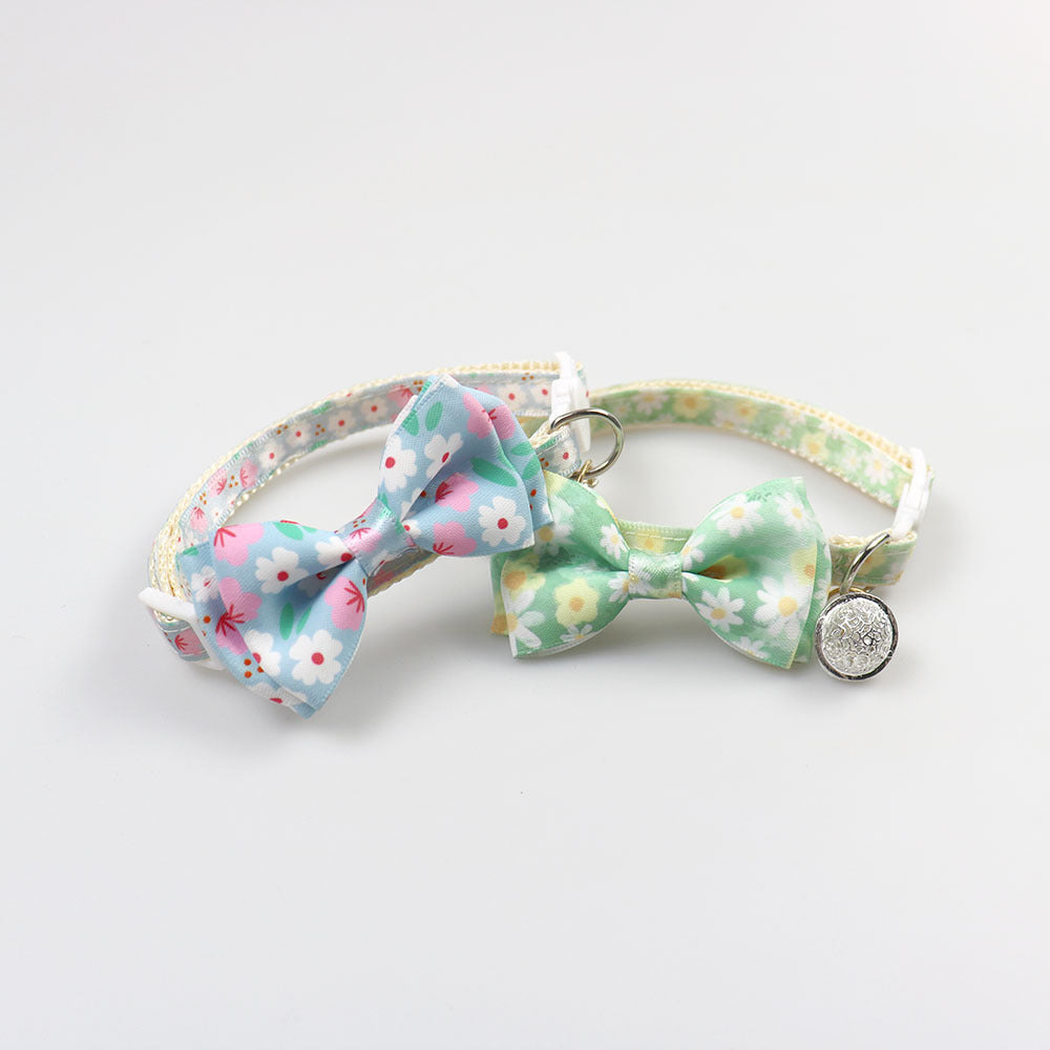 Blue and mint floral bow cat collars displayed together