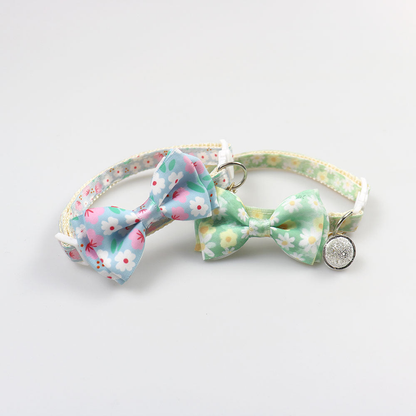 Blue and mint floral bow cat collars displayed together