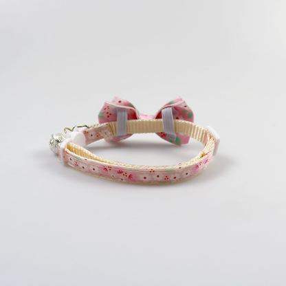 Rear view of the collar strap, bow loops, slider and cat-face buckle