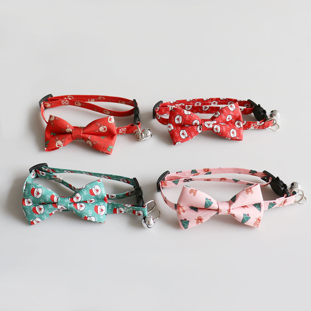 Four festive bow cat collars displayed together