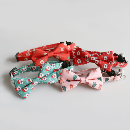 Four festive bow cat collars arranged in a grouped display