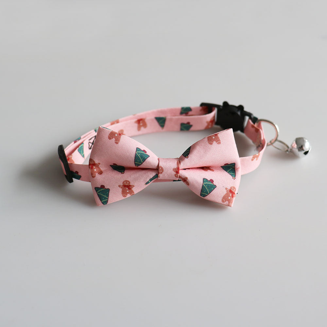 Light pink gingerbread-pattern bow cat collar with bell