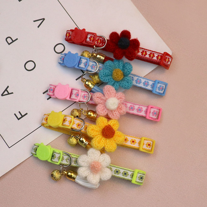 Red, blue, pink, yellow and green floral cat collars displayed together