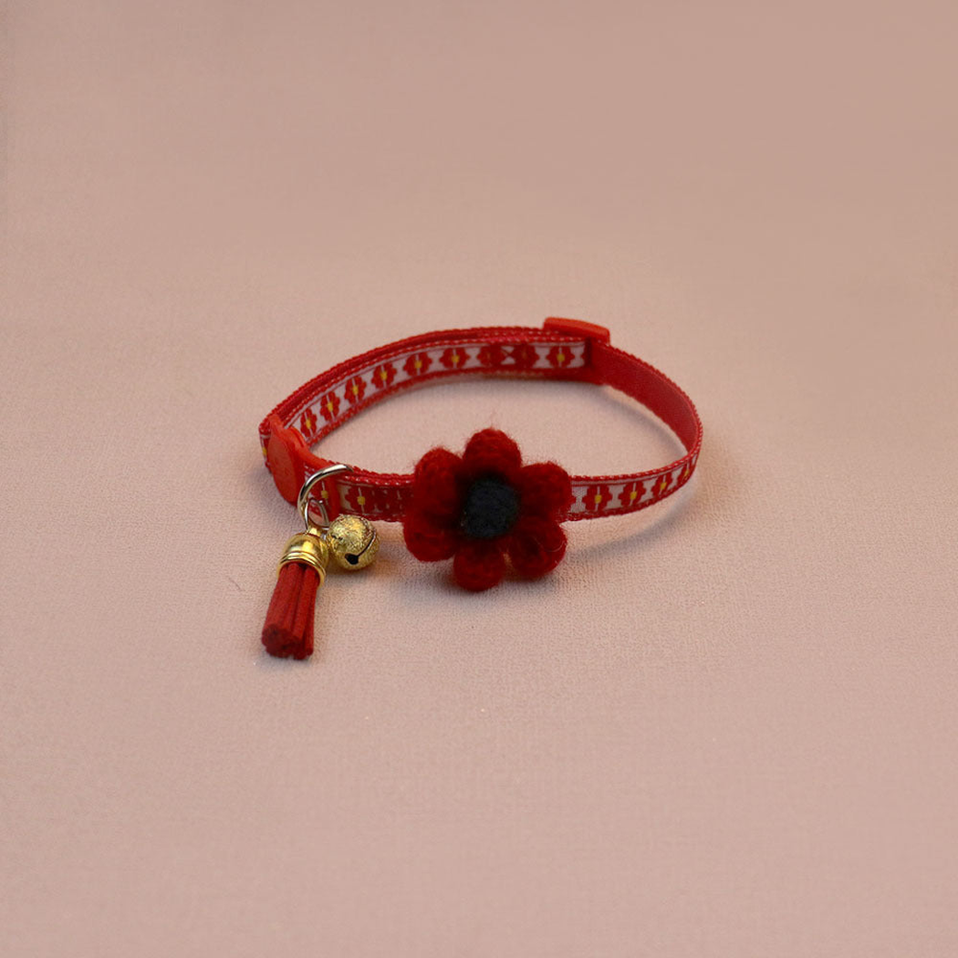 Red floral cat collar with raised flower, bell and tassel