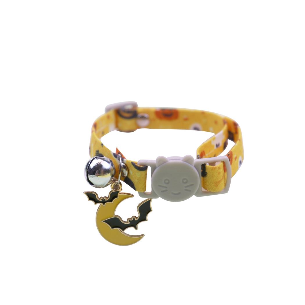 Yellow Halloween cat collar with moon and bat charm