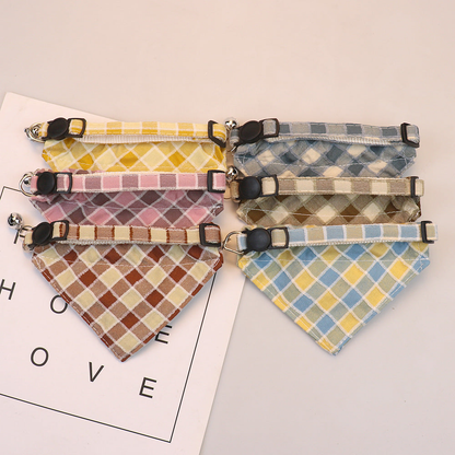 Back view of six plaid bow cat collars with adjustable straps