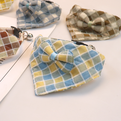Close-up of the plaid bow and stitched triangular collar edge