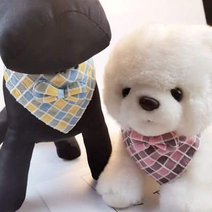 Blue and yellow and pink plaid bow cat collars on animal display figures