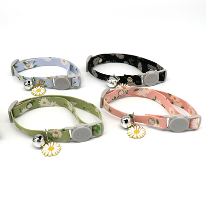 Daisy-print cat collars in gray blue, black, green and pink displayed together
