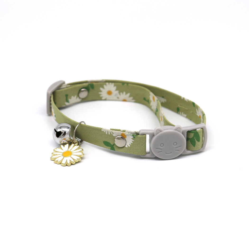 Green daisy-print cat collar with cat-face buckle, bell and flower charm