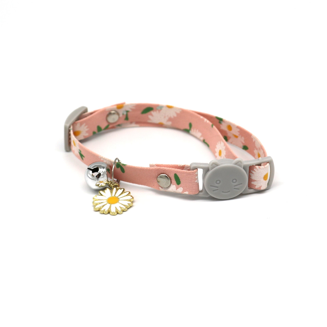 Pink daisy-print cat collar with cat-face buckle, bell and flower charm