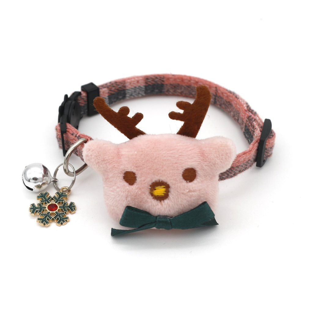 Light pink plaid reindeer cat collar with green bow, bell and snowflake charm