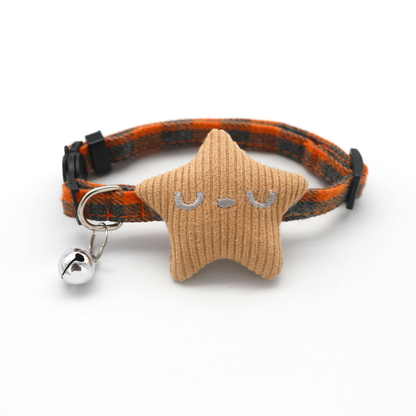 Orange plaid cat collar with ribbed star ornament and bell, front view