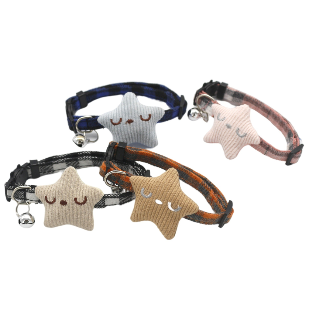 Four plaid cat collars with ribbed star ornaments and silver-tone bells