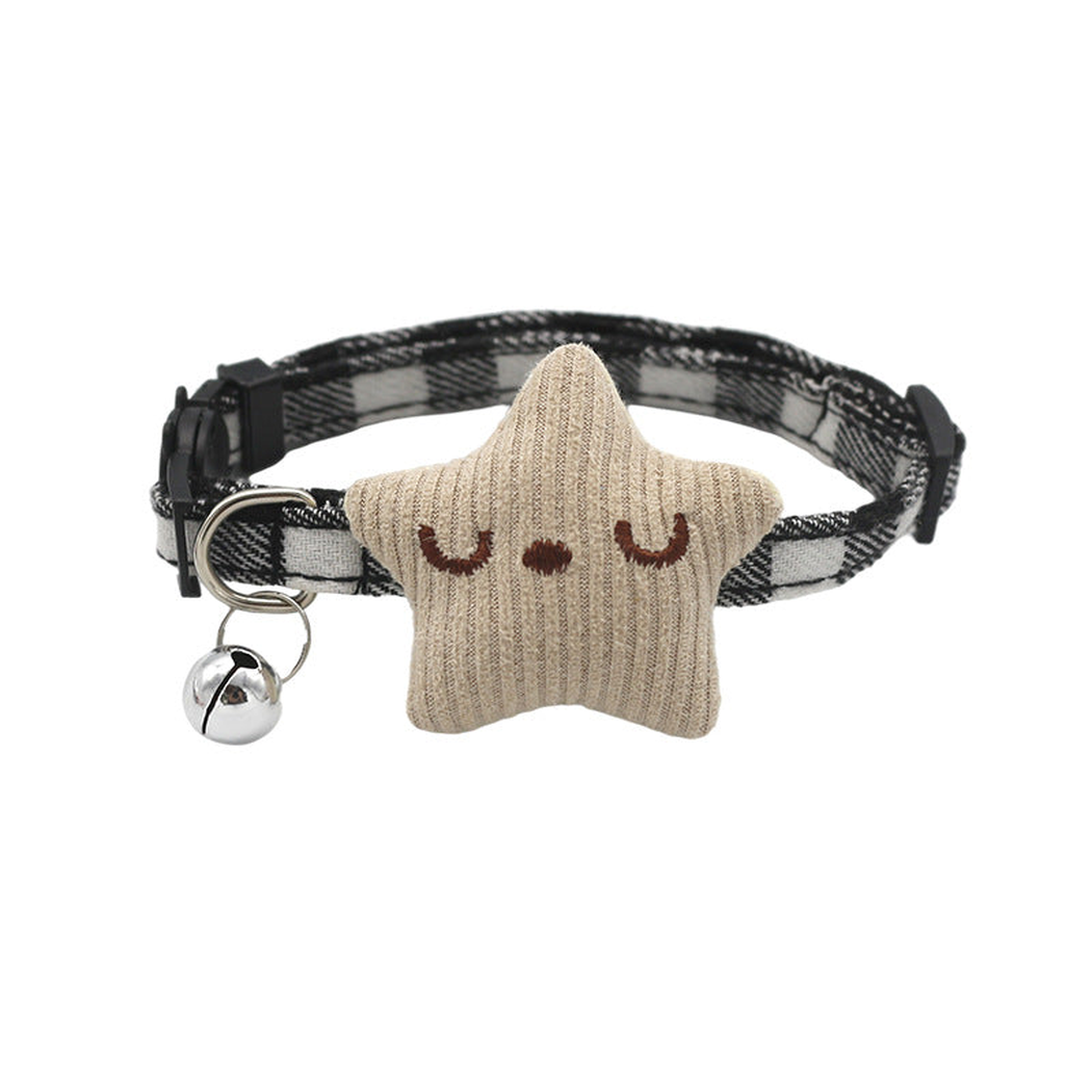 Black-and-white plaid cat collar with cream star ornament and bell