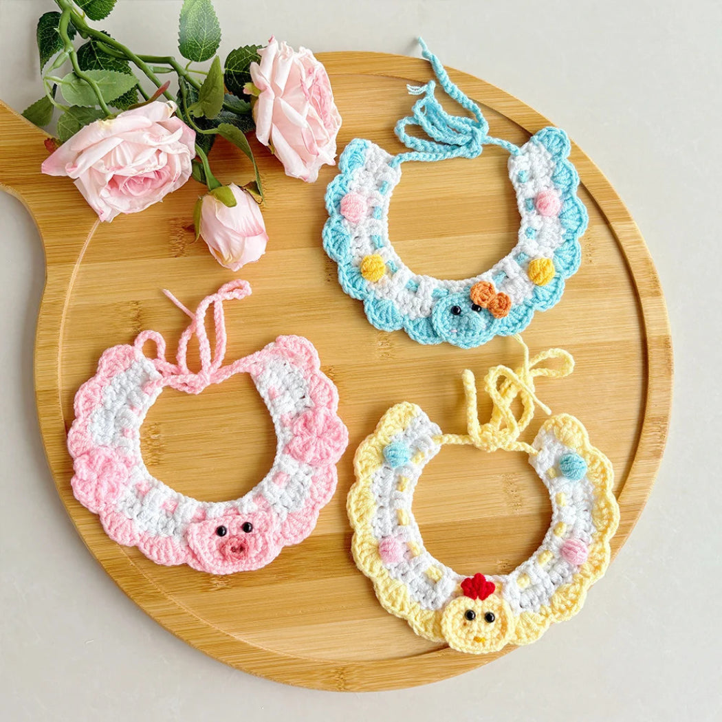 Yellow, pink and blue crochet-look cat neckwear displayed together