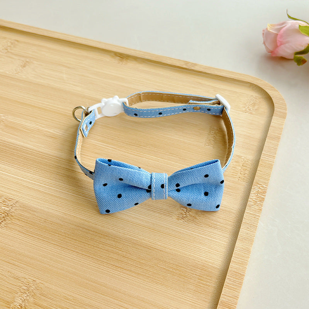Light blue polka-dot bow cat collar with buckle and adjustable strap
