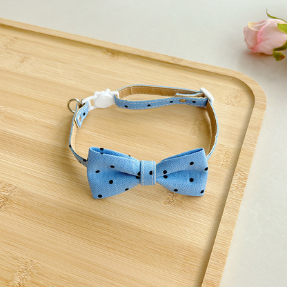 Light blue polka-dot bow cat collar with buckle and adjustable strap