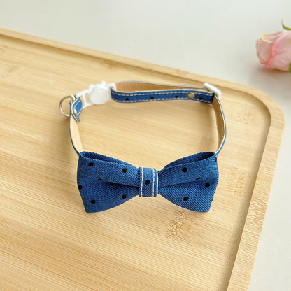Navy polka-dot bow cat collar with buckle and adjustable strap