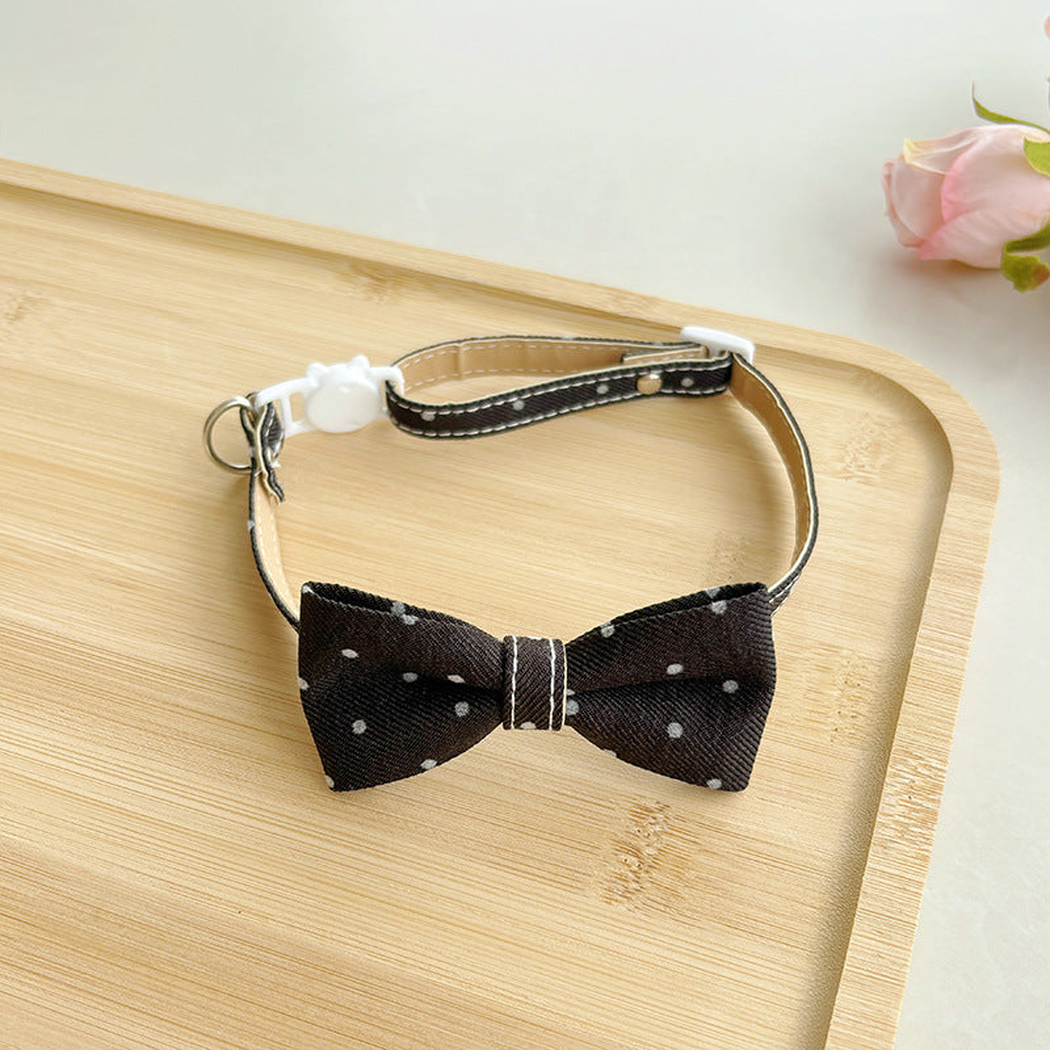 Black polka-dot bow cat collar with buckle and adjustable strap